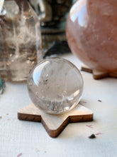 Load image into Gallery viewer, Clear Quartz Sphere w/ laser cut wood base included